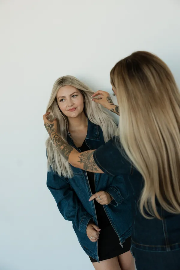 Stylist smiling while her hair is styled